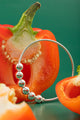 Celestial silver cuff bracelet with polished dot texture, blending starlit charm and modern elegance