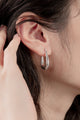 Close-up of the Ethereal Teardrop Hoops, featuring a sleek 35mm teardrop design with a polished sterling silver finish