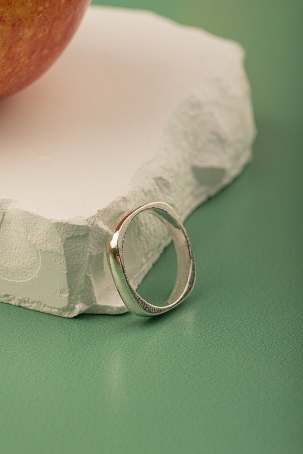 Sleek 2mm silver band with polished oval top – minimalist ring for women.


