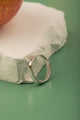 Sleek 2mm silver band with polished oval top – minimalist ring for women.

