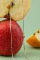 eden’s Chains Collection – Apple Gleam Necklace, a fusion of vintage charm and nature’s seasonal elegance