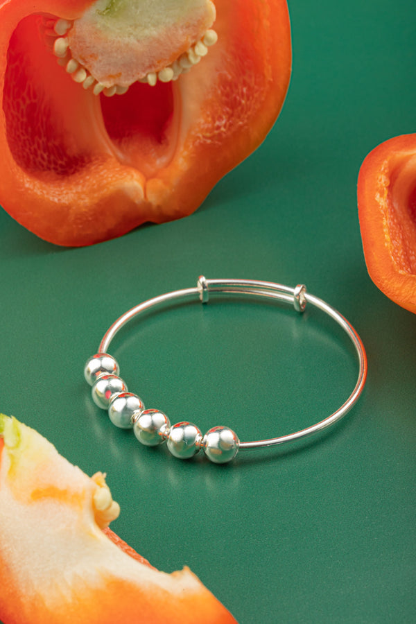 Minimalist boho-chic silver cuff with constellation detailing, perfect for layering or solo wear.