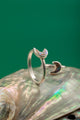 Elegant moon-inspired silver ring with curved band and subtle detailing