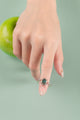 Nature-inspired ring with swirling silver design and crushed seashell