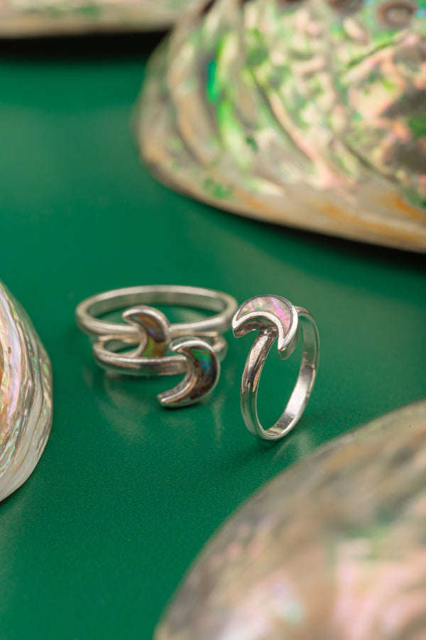 Minimalist sterling silver ring shaped like a crescent moon – nature-inspired design