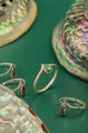 Nature-inspired ring with V-band and ocean-colored inlay