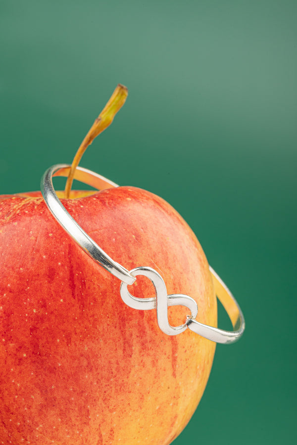 Nature-inspired boho-chic jewelry – The Infinity Cuff reflects balance, connection, and understated elegance.