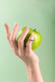 Elegant beaded ring inspired by citrus fruits, displayed on a neutral background