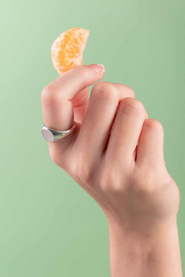 Close-up of handcrafted sterling silver Solar Crest Ring from Argenté’s Minimal Collection

