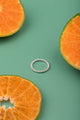 Twisted silver ring styled naturally with fruit – artisan sterling jewelry.