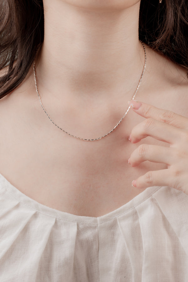 A handcrafted sterling silver necklace, made in Hoi An, Vietnam, and polished in London, ON, Canada.