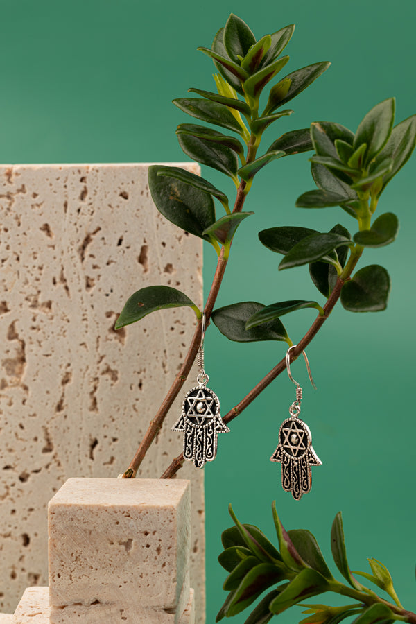 A handcrafted sterling silver earring set, made in Hoi An, Vietnam, and polished in London, ON, Canada.