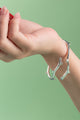 A handcrafted sterling silver cuff bracelet, made in Hoi An, Vietnam, and polished in London, ON, Canada.