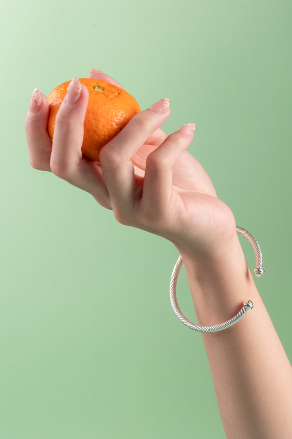 A handcrafted sterling silver cuff bracelet, made in Hoi An, Vietnam, and polished in London, ON, Canada